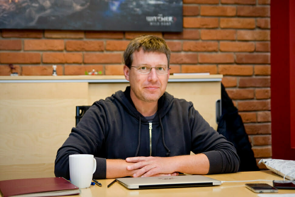 Adam Kicinski Sitting on a table