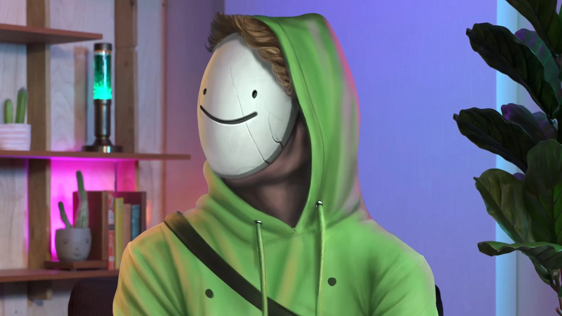 A person in green hoodie wearing a white mask with smiley drawn on it